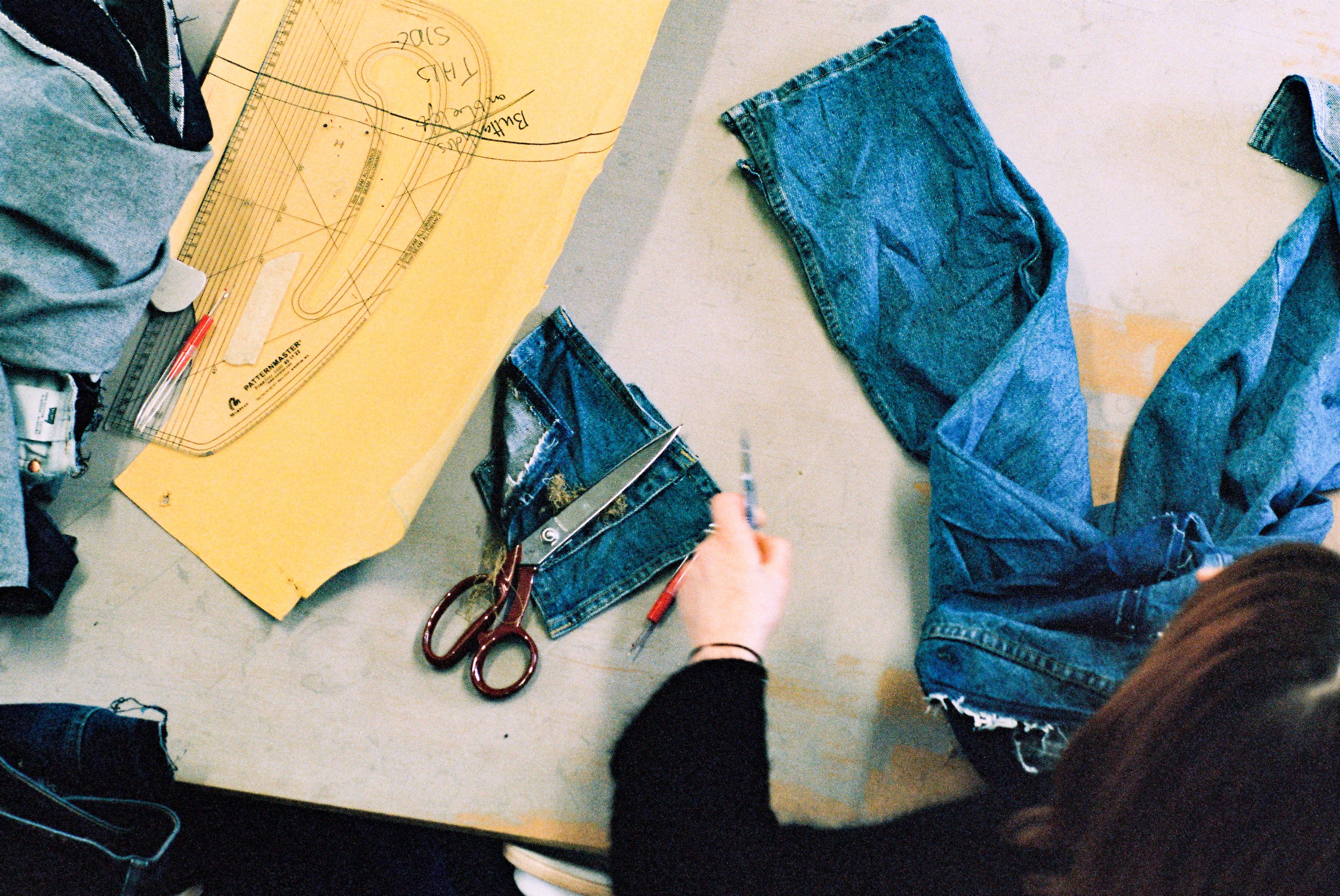 Siobhan, founder of rejean, in the studio pattern cutting